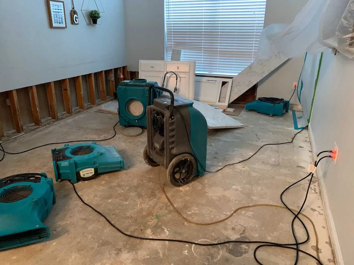 Dehumidifier in flood-cut room for Water Damage Restoration in Evans